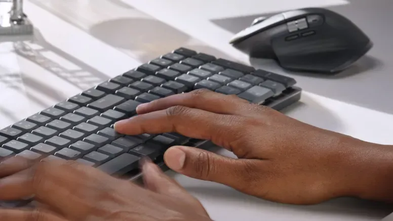 Close up of keyboard in use on desk