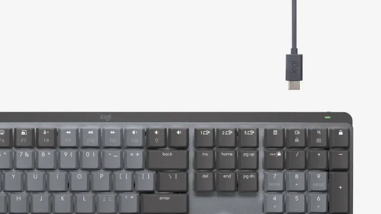Keyboard showing USB-C about to be plugged in